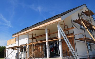 a man is working on the construction of a new house