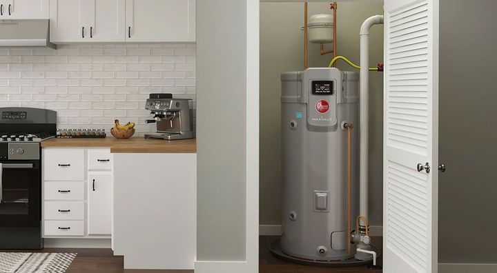 a kitchen with a water heater in the corner