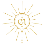 Gold monogram in a sunburst with hanging beads on a white background