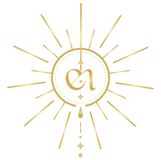 Gold monogram in a sunburst with hanging beads on a white background