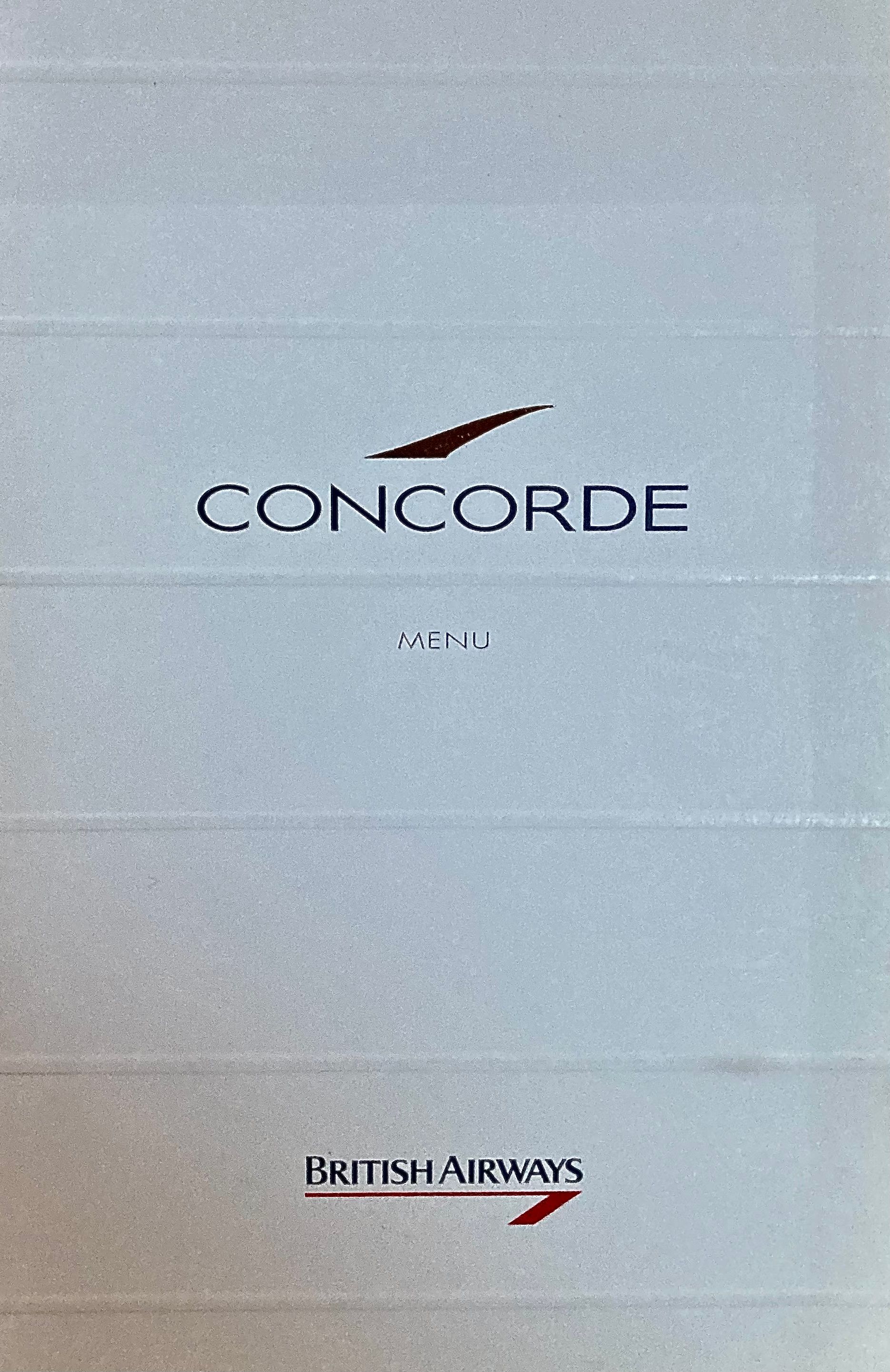 Auf einem Tisch liegt eine Concorde-Broschüre von British Airways.