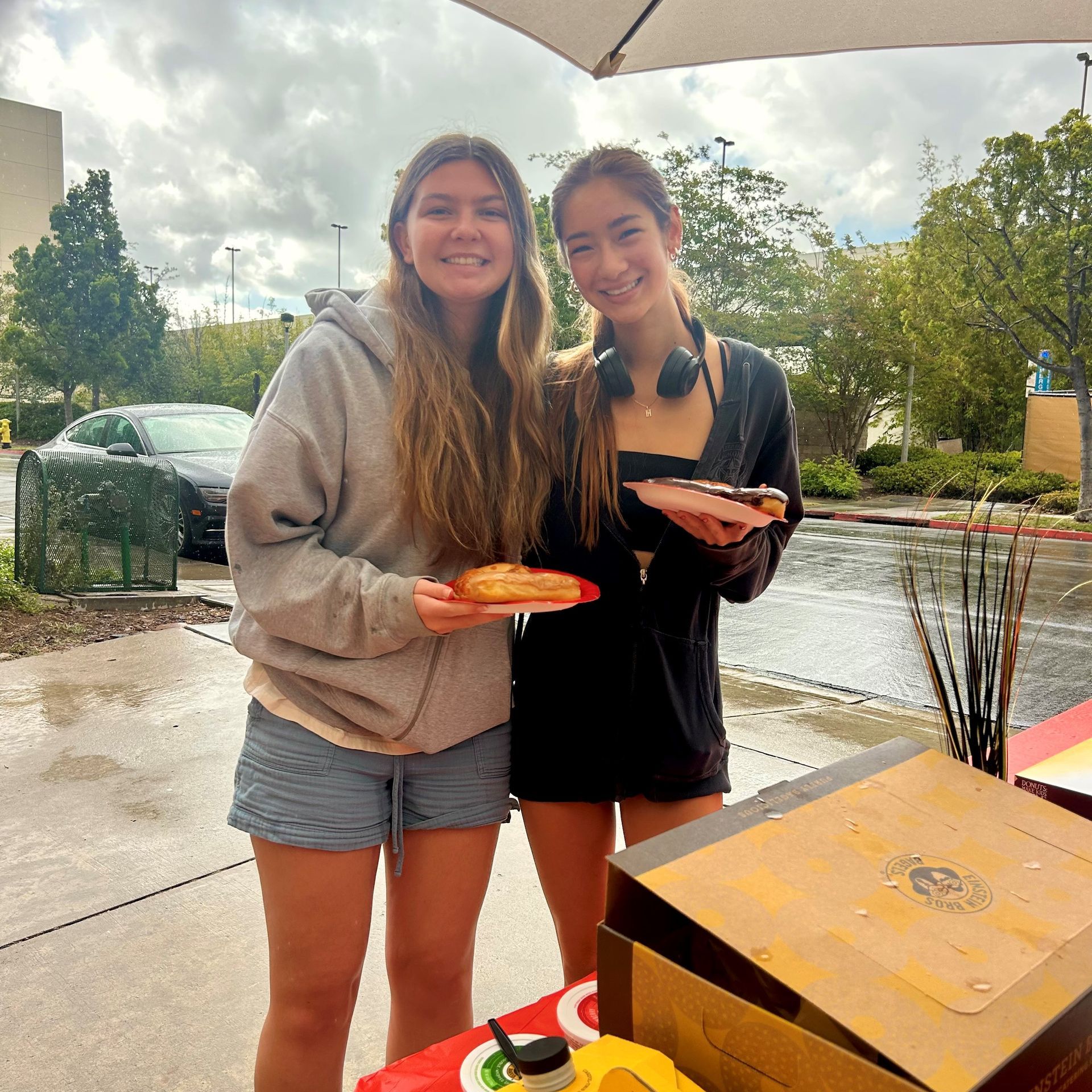Residents enjoying coffee and donuts at Hardy Apartments community event