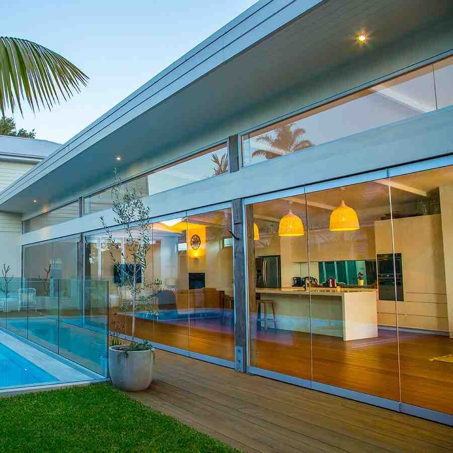 residential exterior with strategic lighting - privacy window film that works at night