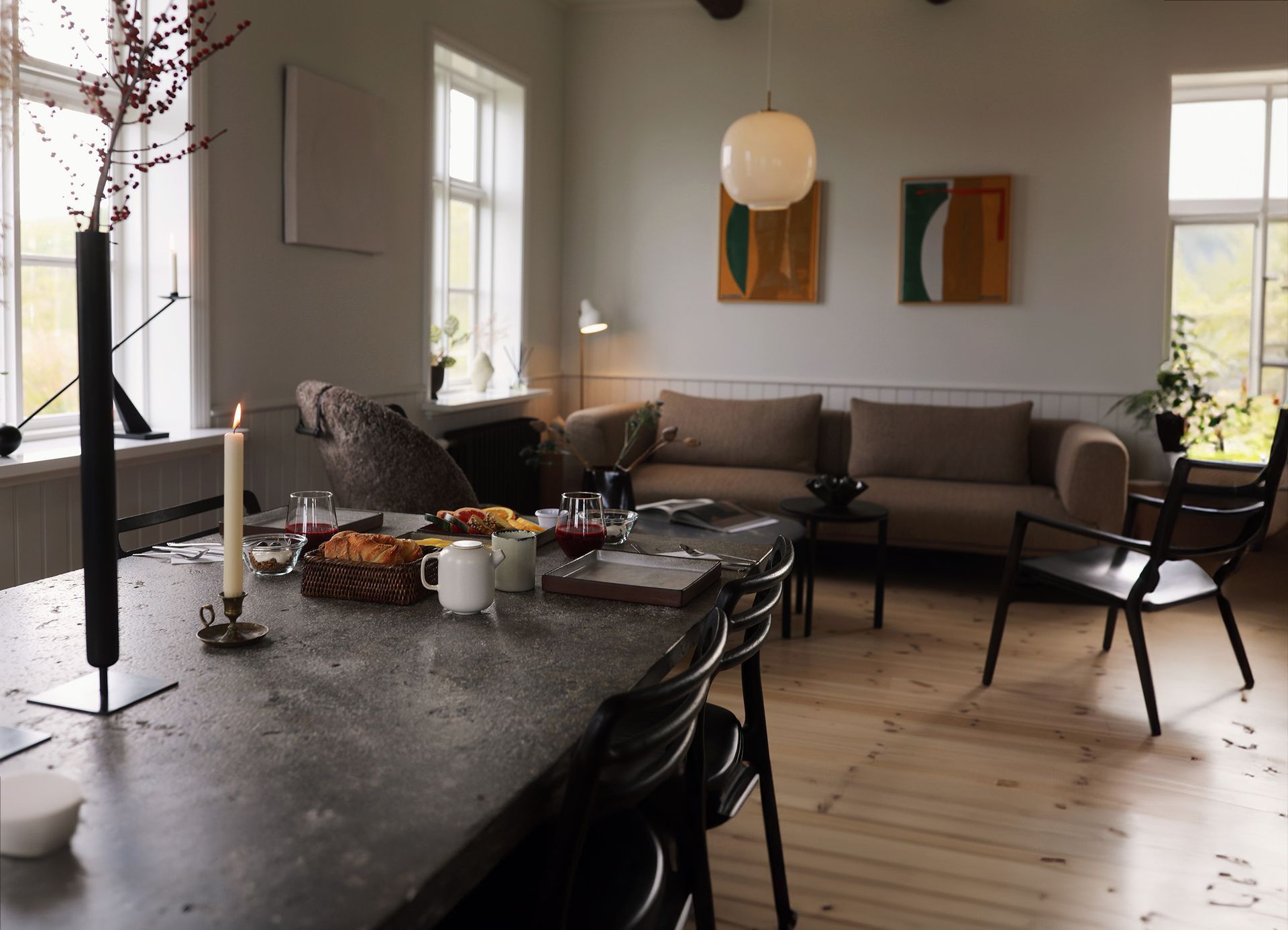 a living room with a table and chairs and a couch