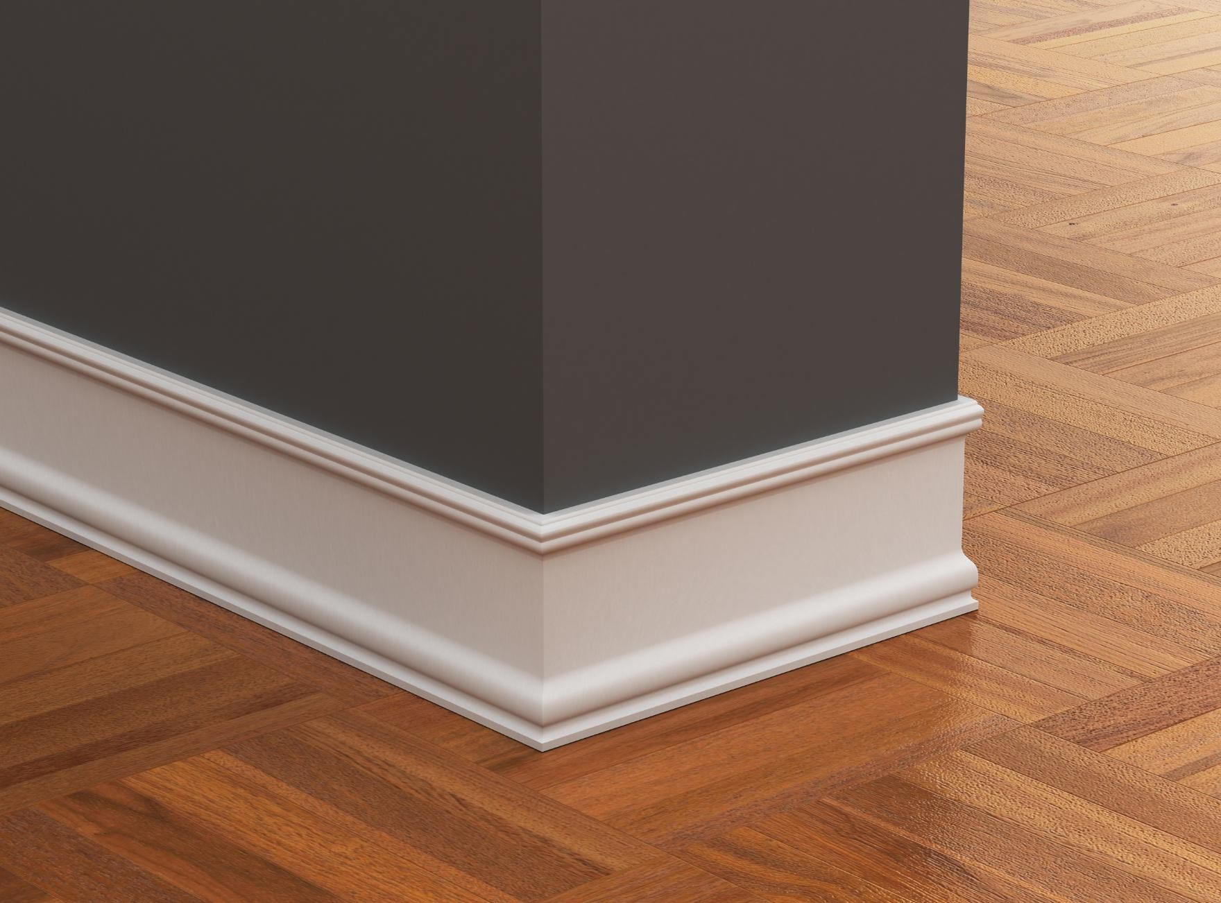 A corner of a room with a wooden floor and a gray wall.