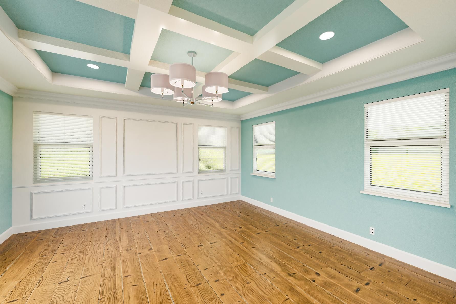 An empty room with blue walls and hardwood floors and a chandelier.