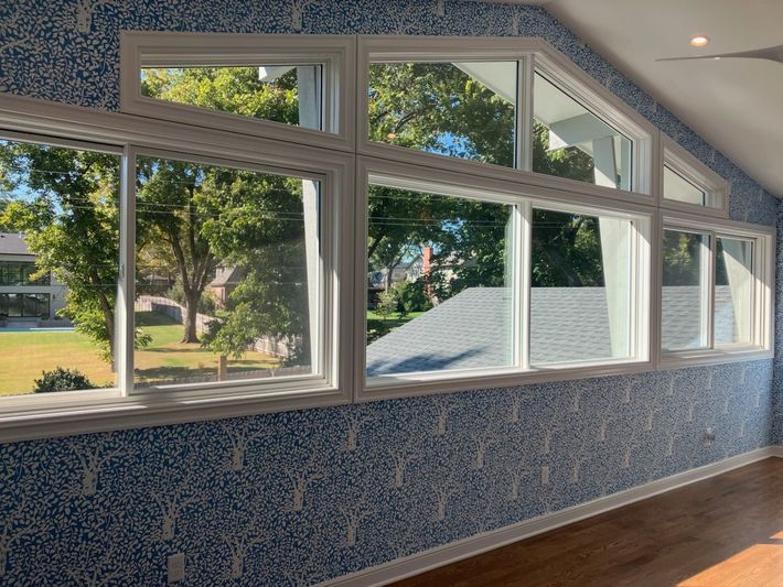 A close up of a ceiling with a white molding.