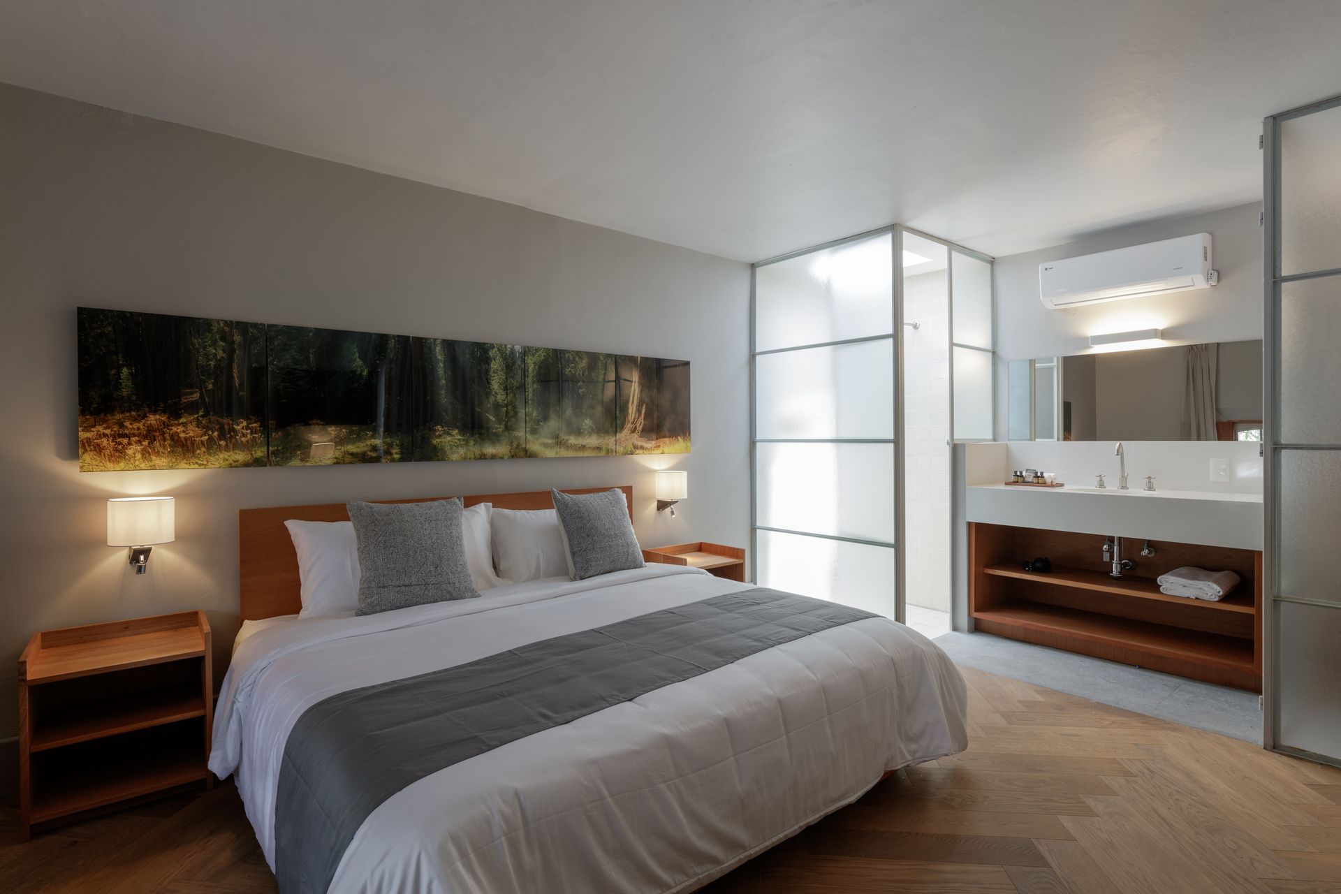 A bedroom with a king size bed and a bathroom