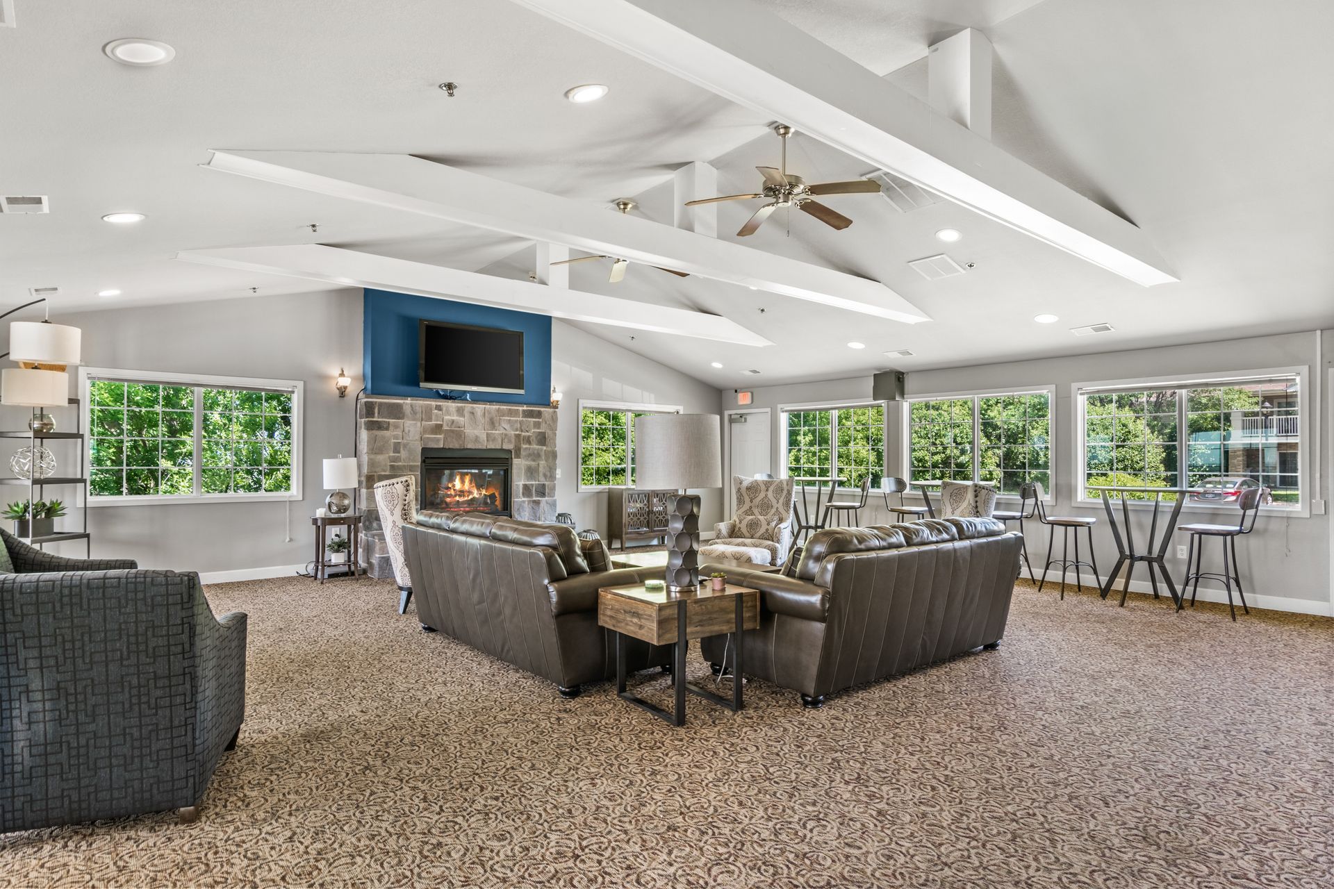 A living room filled with furniture and a fireplace.