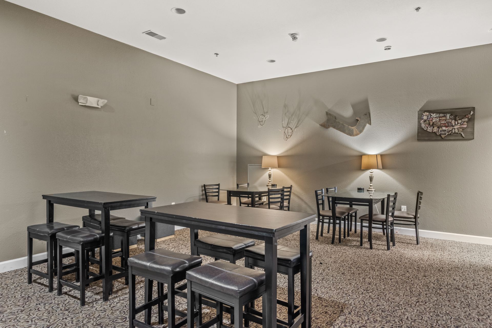 A room with tables and chairs in it