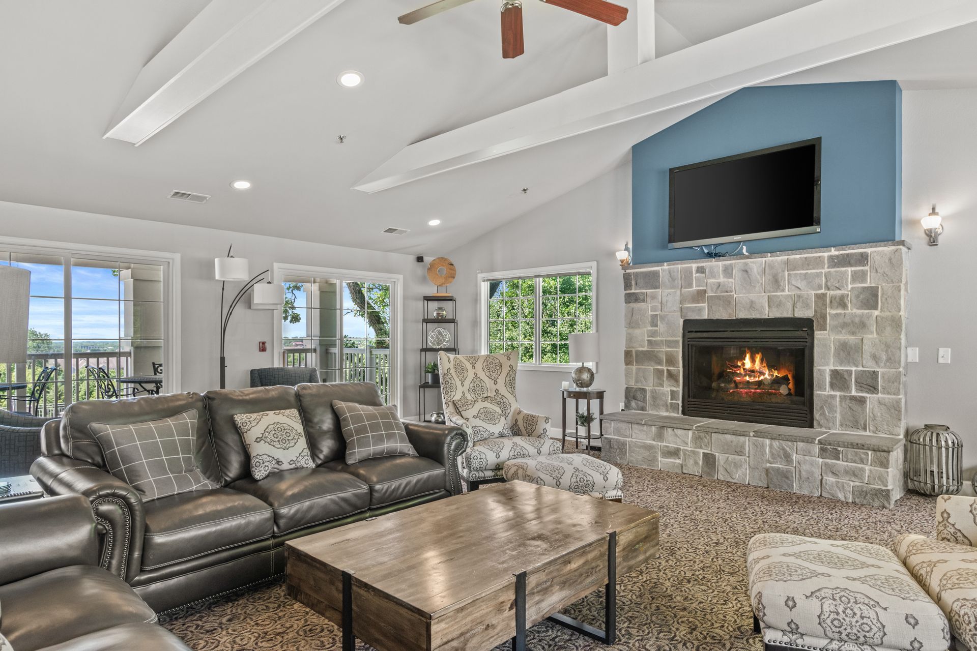 A living room filled with furniture and a fireplace.