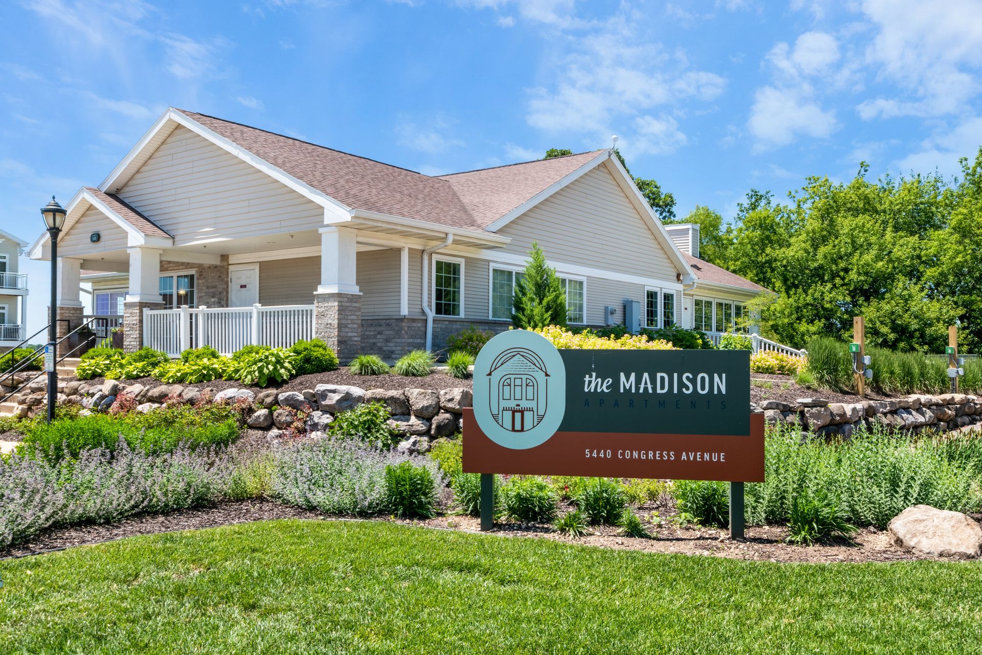 A house with a sign in front of it that says the madison.
