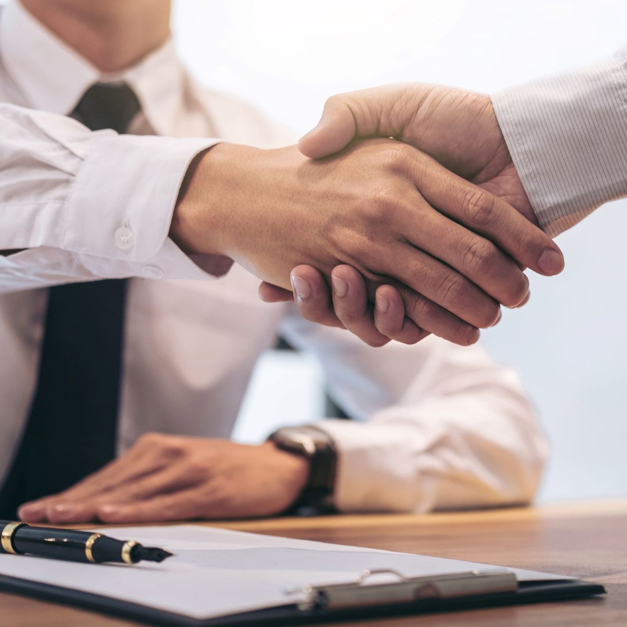 two men shaking hands
