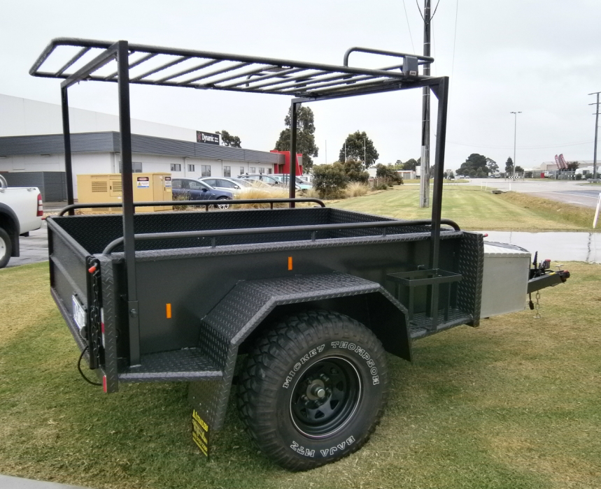 A trailer with a roof rack attached to it