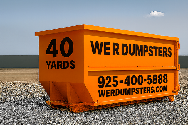 An orange 40-yard dumpster sits on a gravel surface with the company name, phone number, and website printed on its side.
