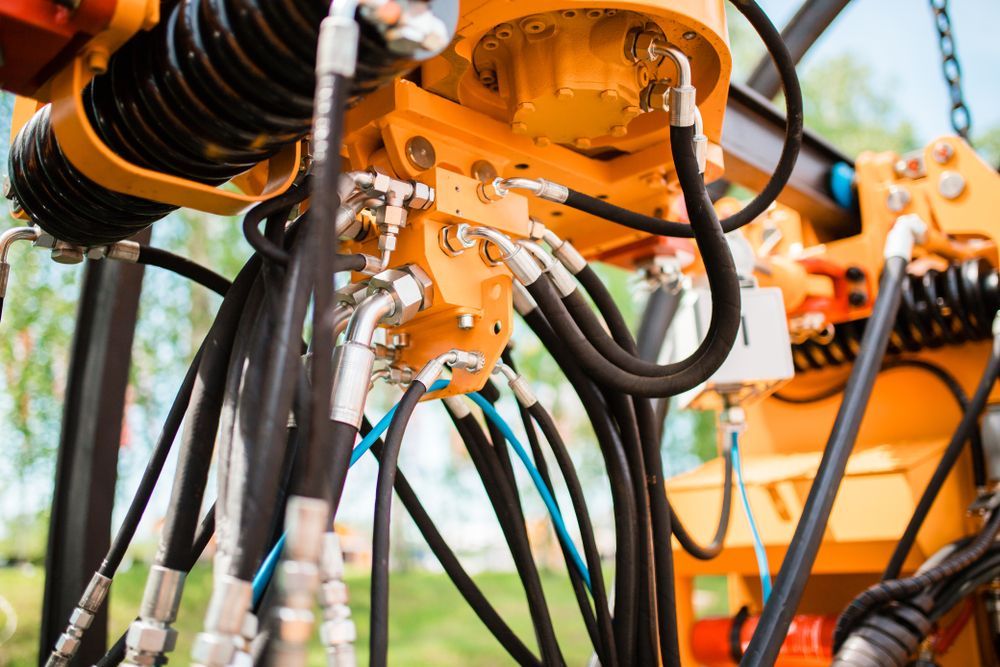 Yellow Industrial Machinery With Black and Silver Hydraulic Hoses — Alloway Hydraulics in Mount Saint John, QLD