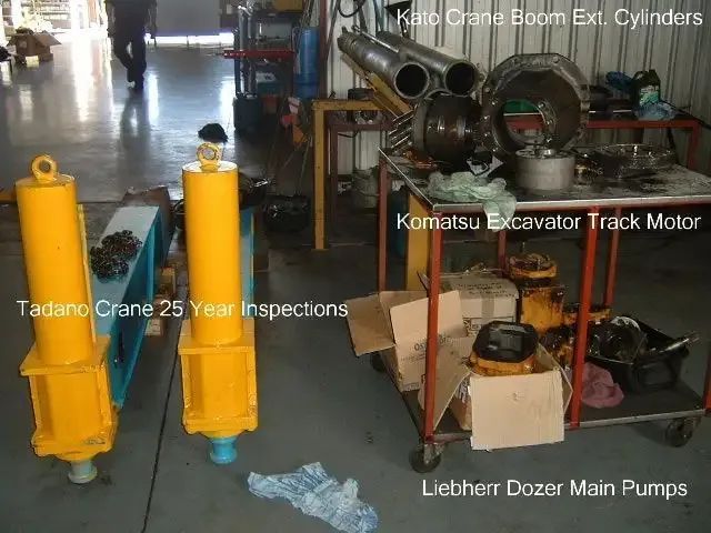 Workshop With Crane and Excavator Parts — Alloway Hydraulics in Mount Saint John, QLD