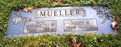 Gravestone for Mueller with names Kenneth P. and Mary R., surrounded by grass and flowers.