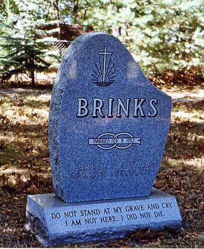 Blue gravestone in a wooded area with “BRINKS” engraved and the quote, “Do not stand at my grave and cry.”