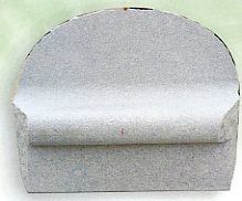 Gray curved foam pad with a rounded top and a horizontal cushion-like ridge