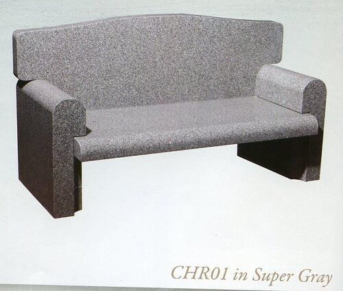 Gray upholstered two-seat couch with low arms and back, shown on a white background.