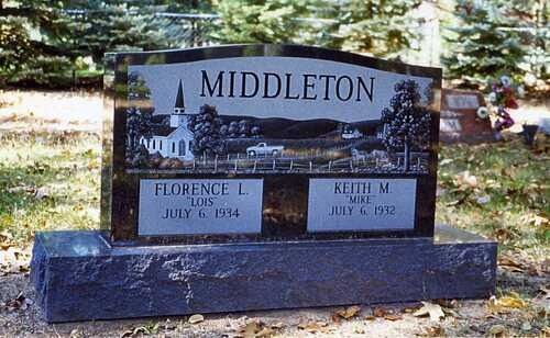MIDDLETON cemetery headstone with castle engraving and memorial plaques in a wooded setting
