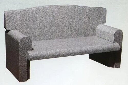 Gray upholstered loveseat with high back and armrests on a plain white background