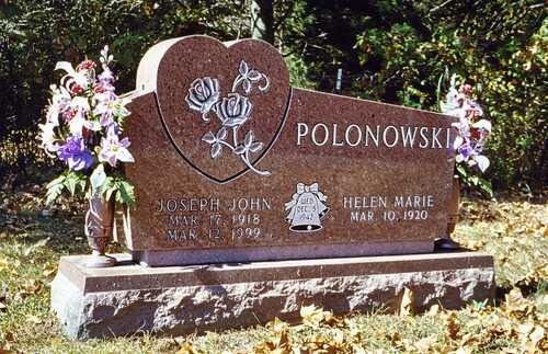 Polonowski family gravestone with heart-shaped headstone and flower vases in a cemetery