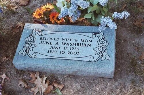 Gravestone for Beloved Wife & Mom June A. Washburn, dated June 10, 2023, with blue flowers.