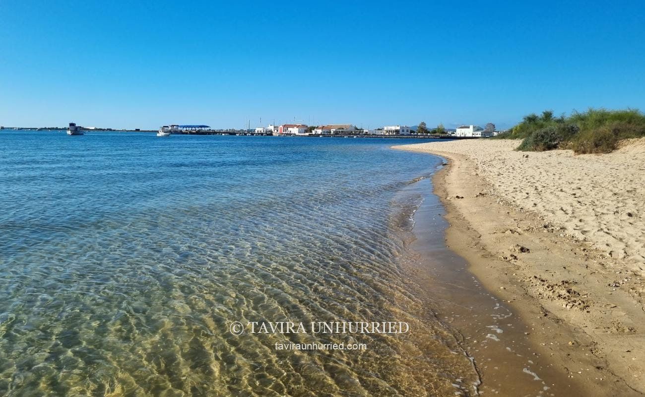 Clear water and the sandy shoreline near Tavira