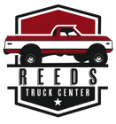 Reeds Truck Center logo with red-and-white pickup inside a black shield emblem
