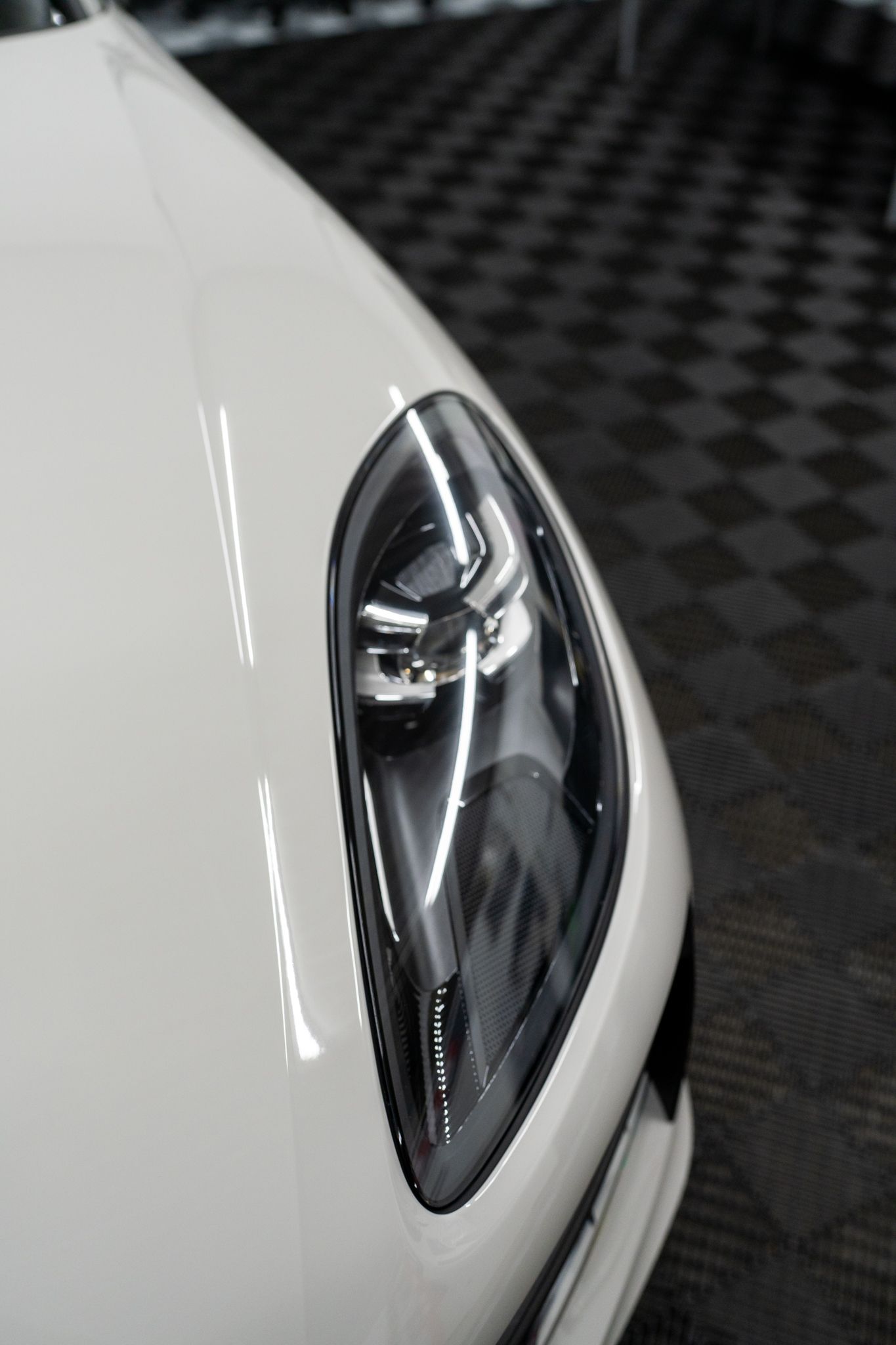 White car headlight detail.