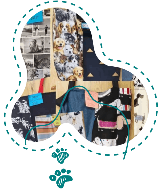 A board with pictures of dogs on it and a paw print