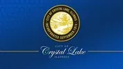 Crystal Lake logo on a blue background with a gold circular emblem and white script text