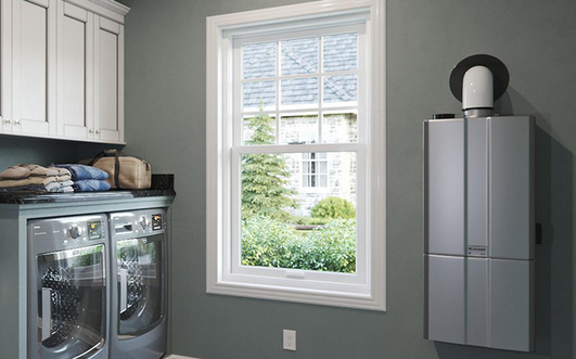 A laundry room with a washer and dryer and a window A laundry room with a washer and dryer and a window