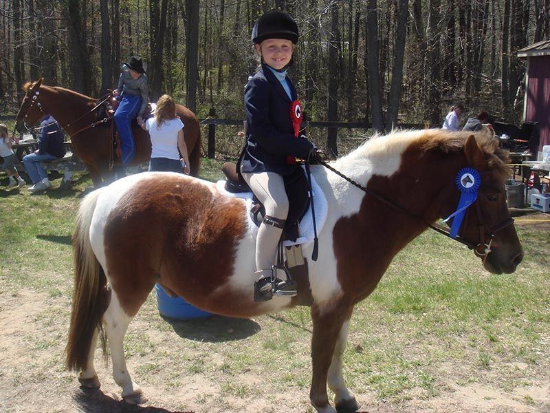 Kid Riding A Horse