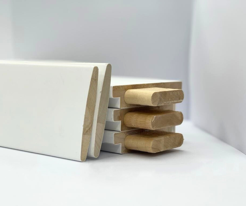 A stack of white wooden blocks sitting on top of each other on a table.