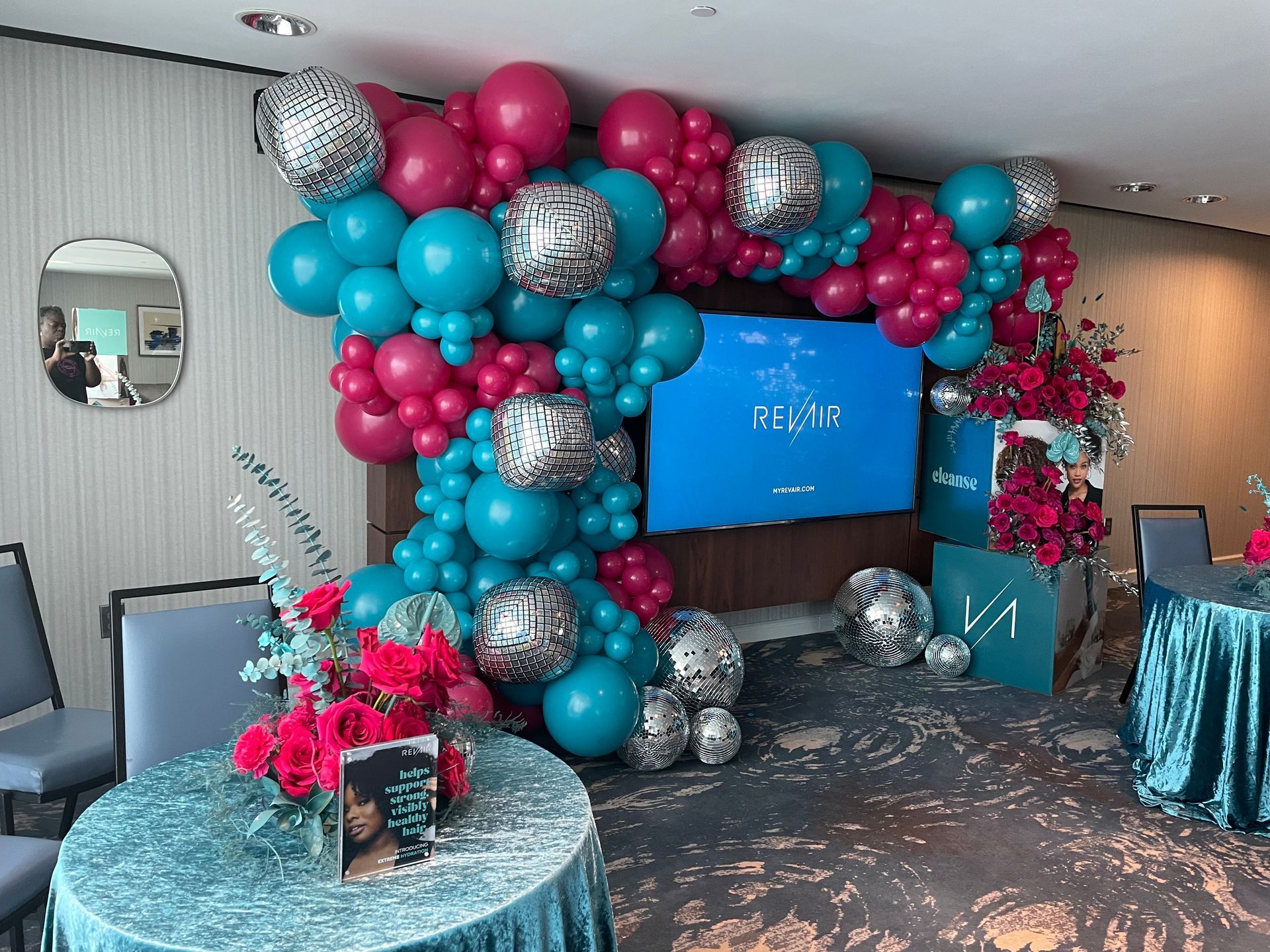 Teal hot pink and silver disco balloon garland with metallic accents for bold corporate or brand event display