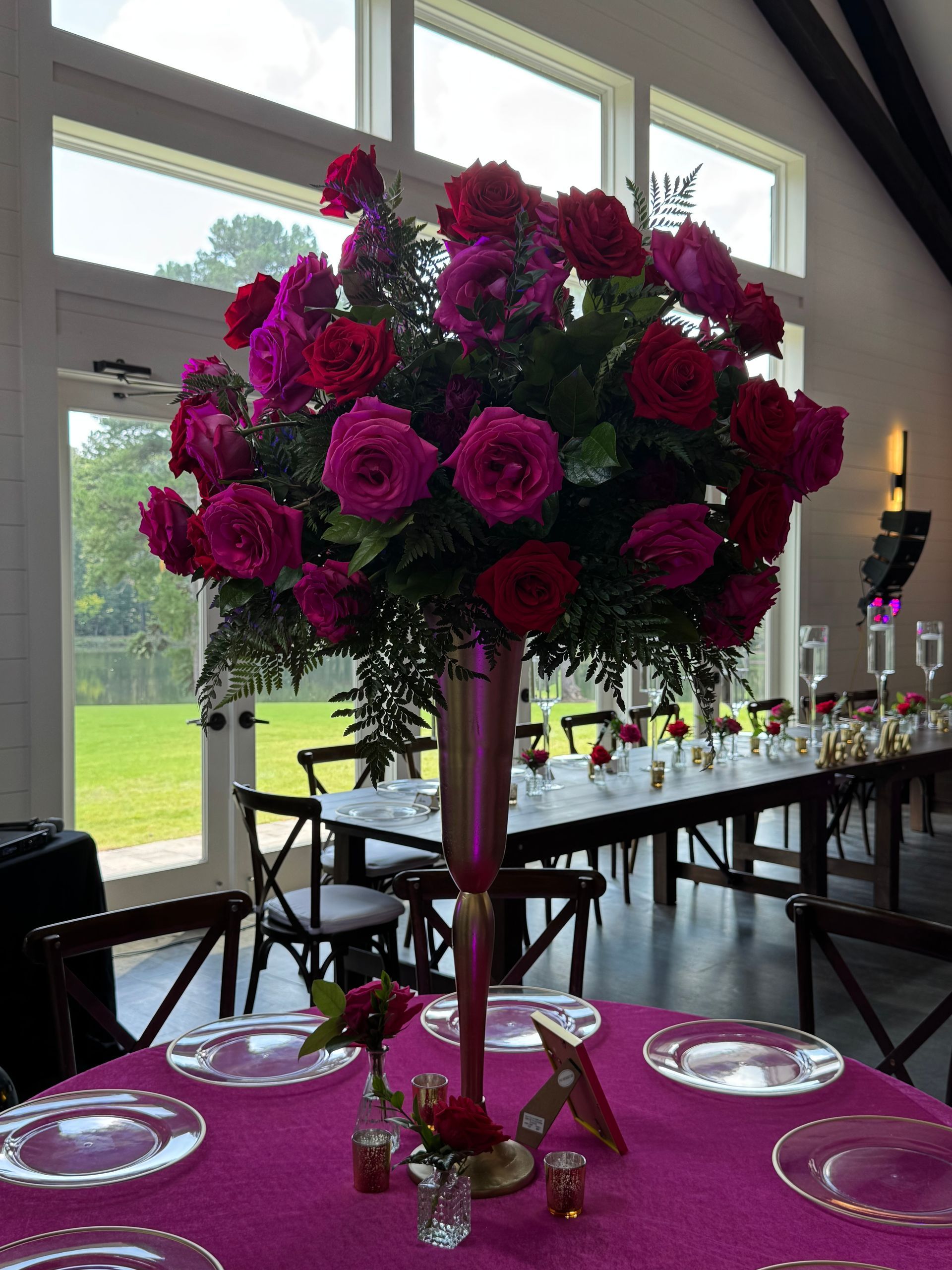 Large red rose floral centerpiece arrangement for romantic wedding or formal event décor