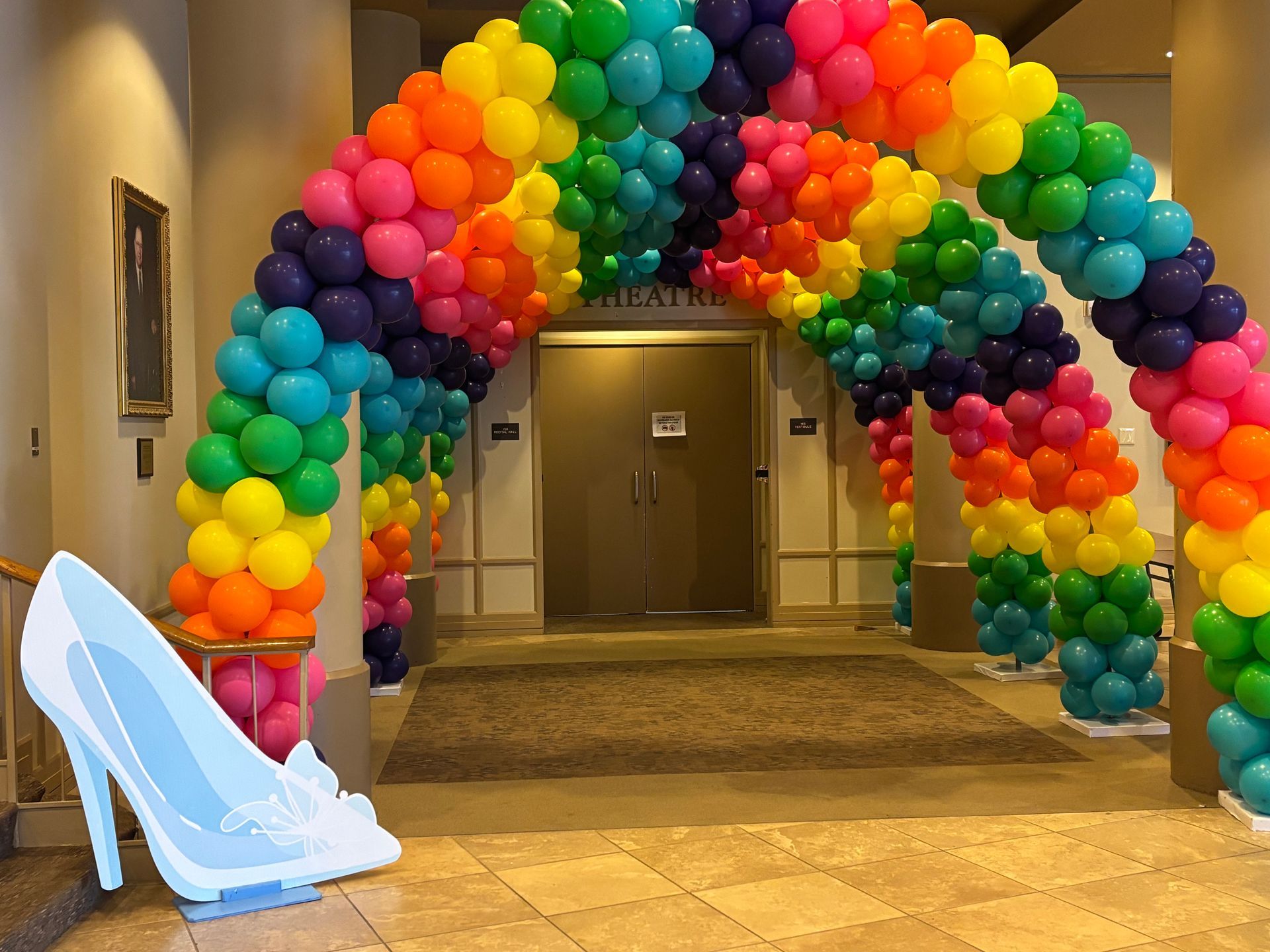 Colorful rainbow balloon arch entrance created by Party Divas in Fayetteville GA