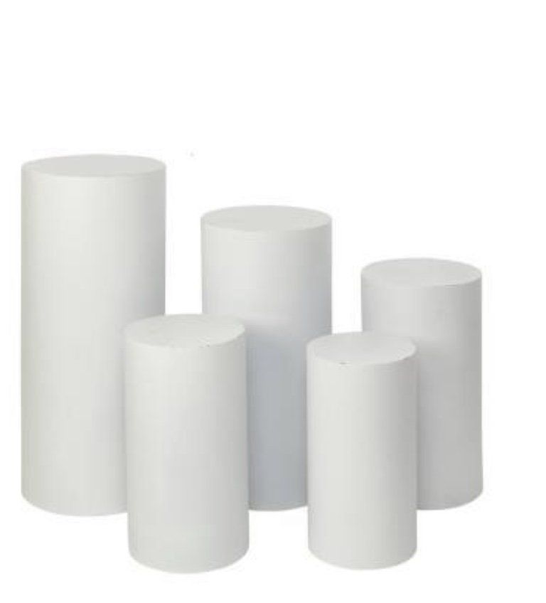 White cylinder pedestal stands in multiple heights for cake or dessert table displays