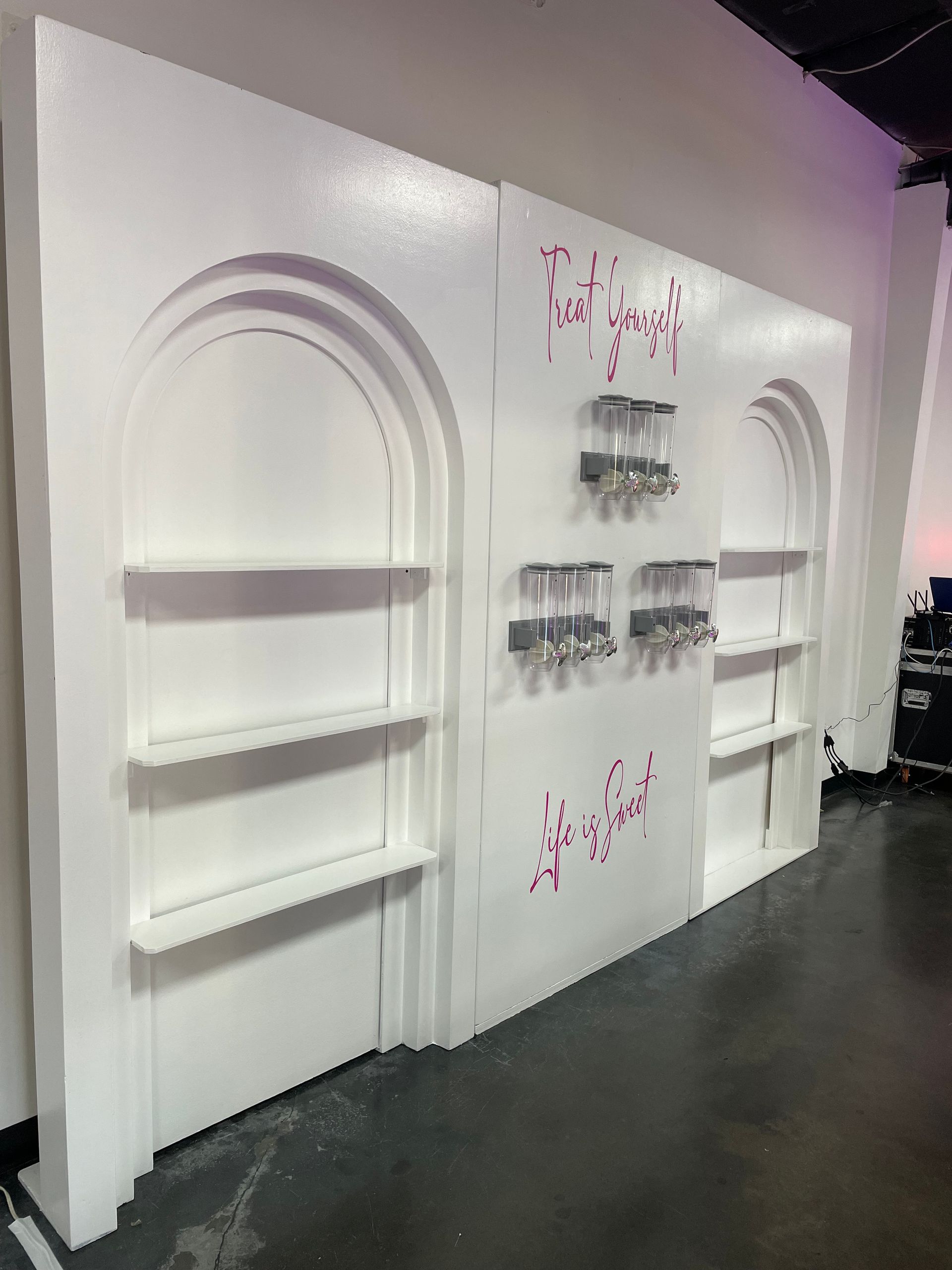 White modern arch wall backdrop rental with built-in shelves for desserts or displays