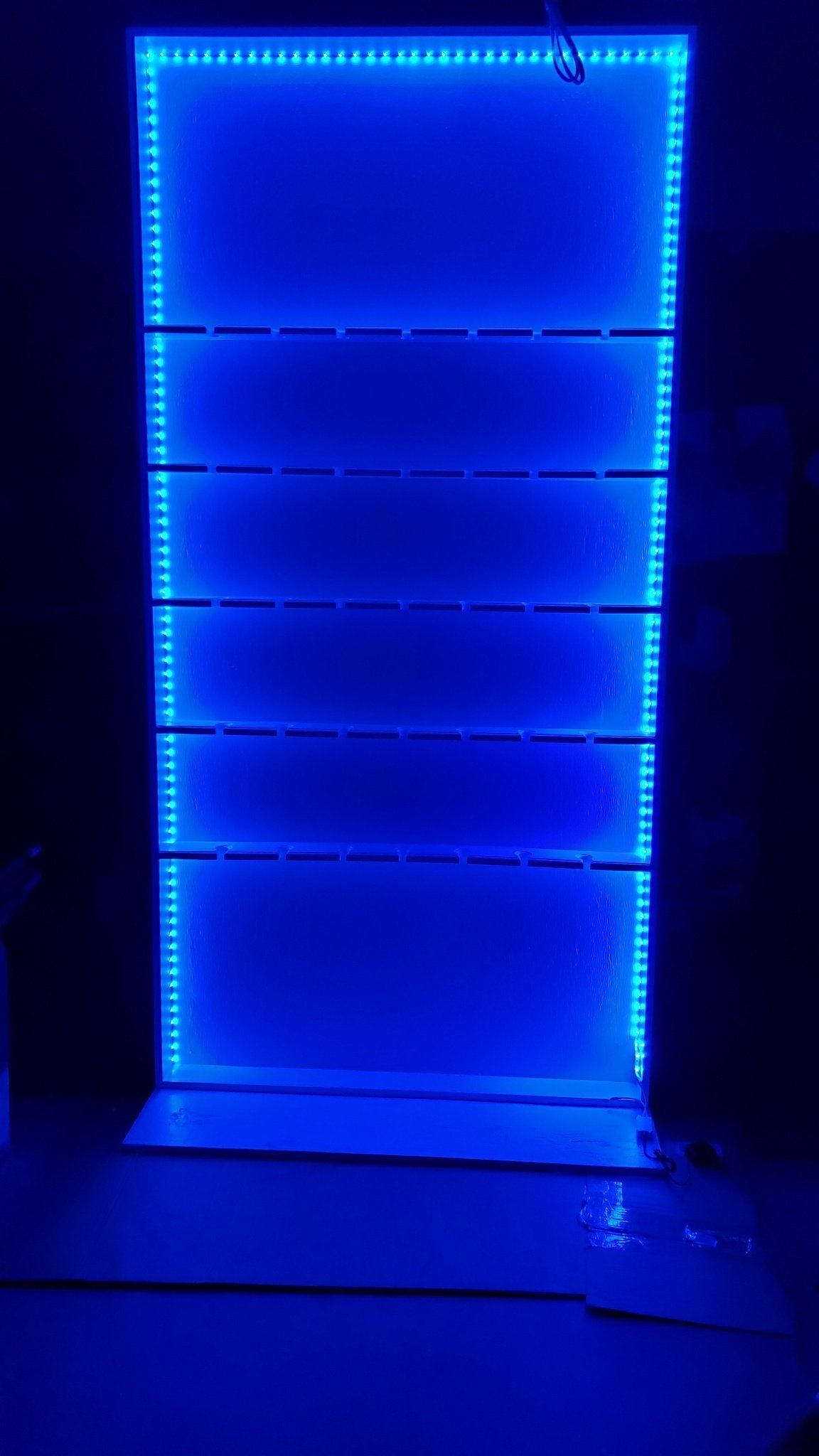 Blue LED illuminated display wall or bar shelving rental for modern event lighting décor