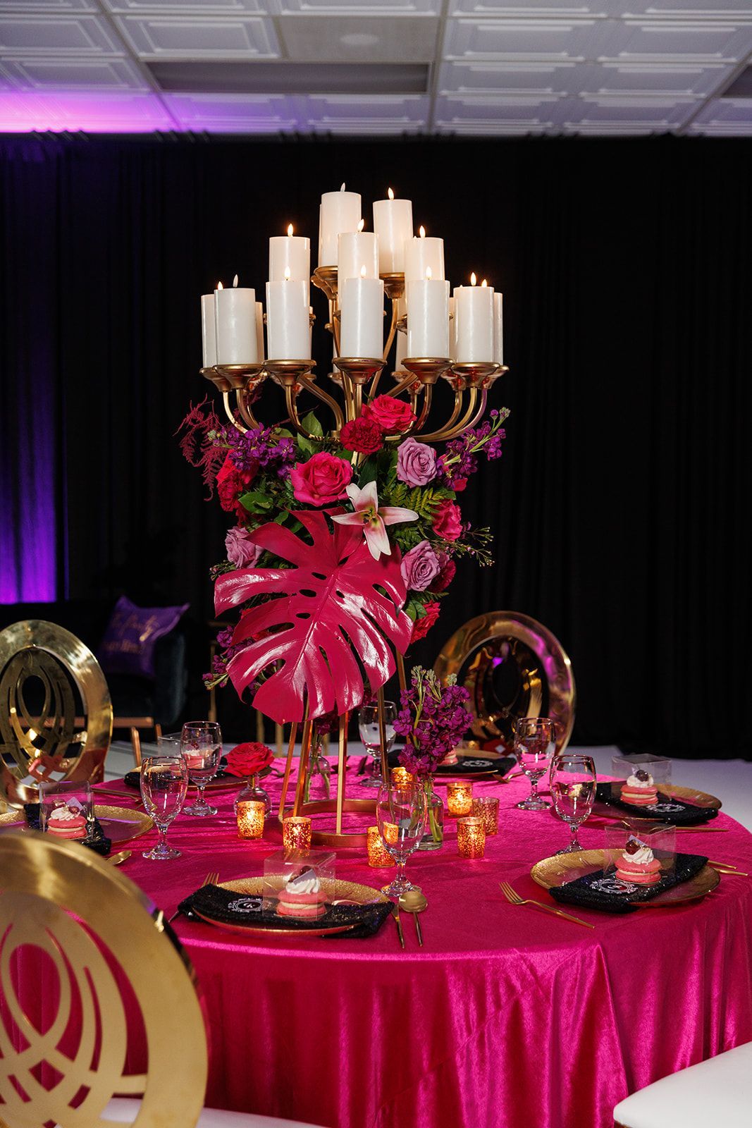  stylish centerpiece with gorgeous white flowers in a tall vase.