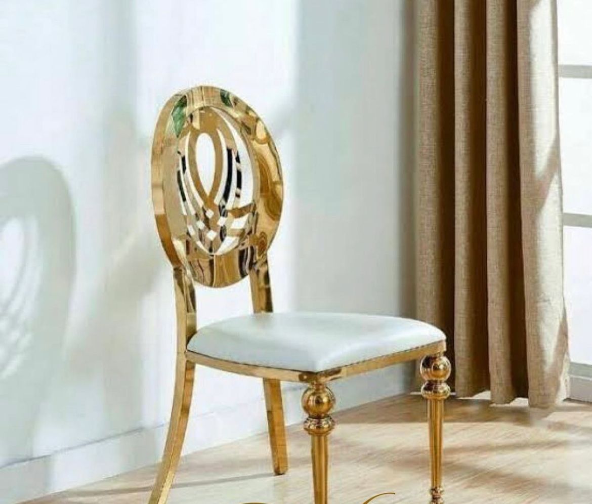 Clear acrylic and gold accent chair for modern luxury event seating rentals
