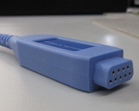 Blue serial port cable connector with 9 pins.