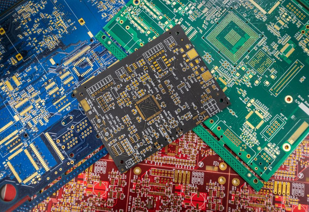 Colorful circuit boards with a black microchip centered on top