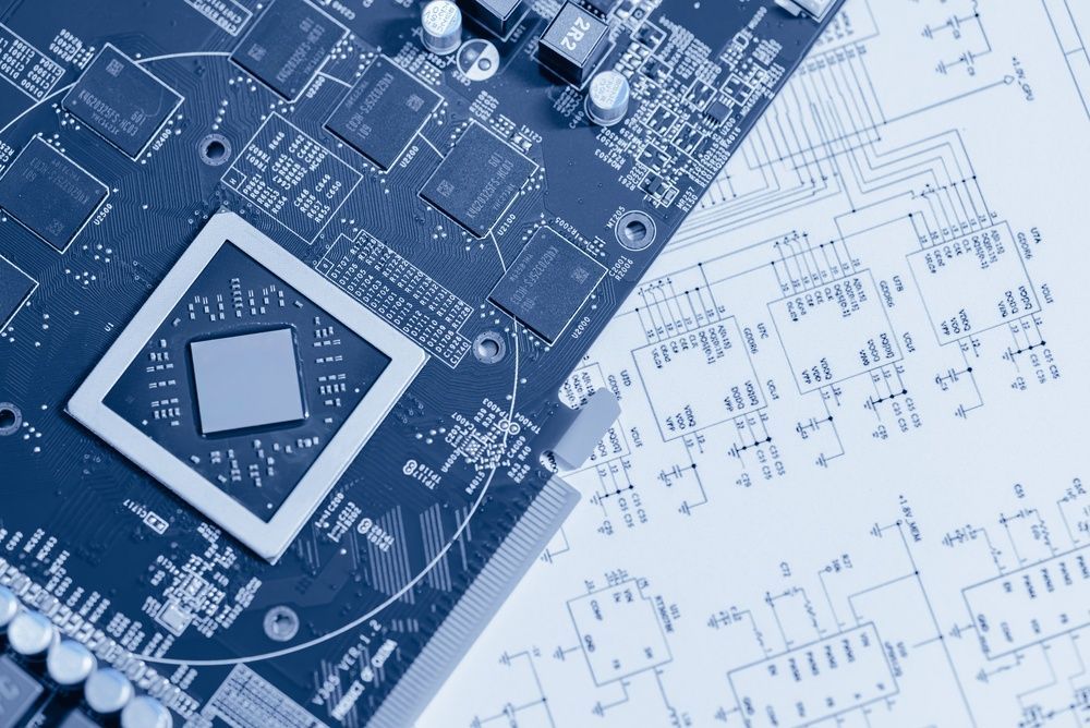 Blue circuit board overlaid on technical schematics with a central chip and small components