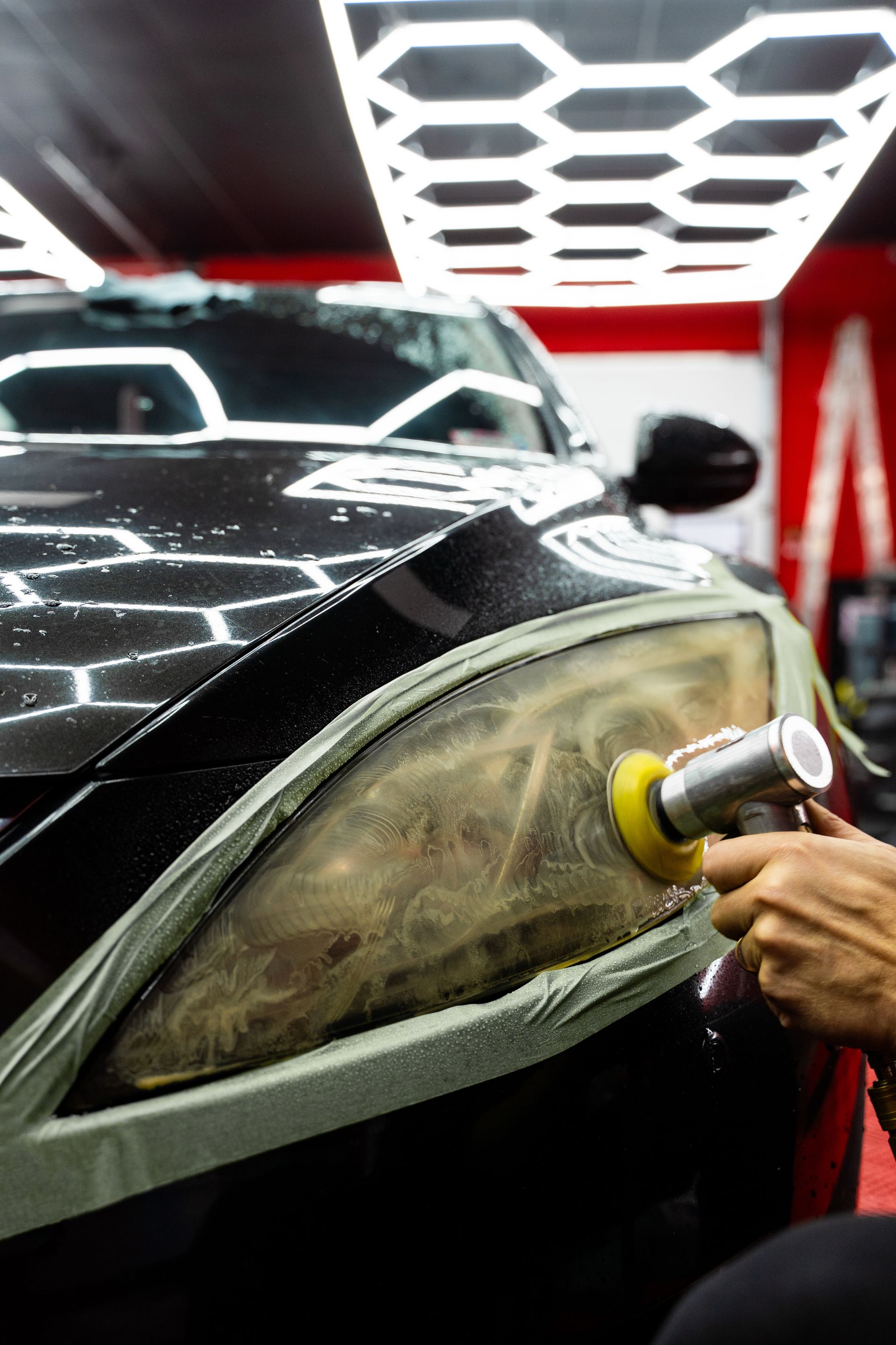 A gray house with a blue door and windows