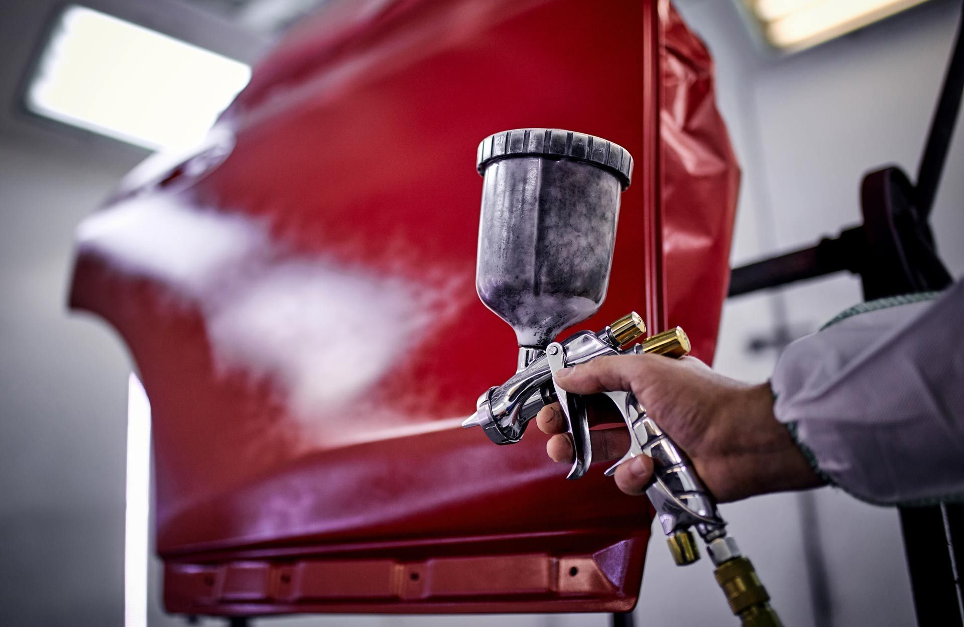 A gray house with a blue door and windows